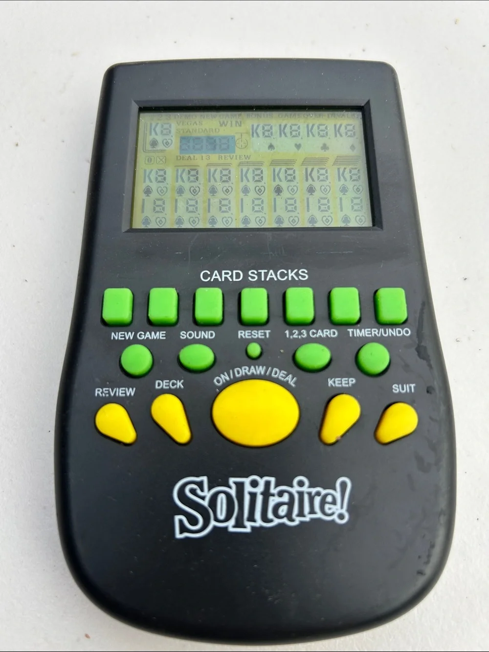 Handheld Electronic Solitaire Game - Black with Green & Yellow Buttons